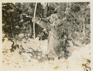 Image of Nascopie Indian [Innu] with bow and arrow